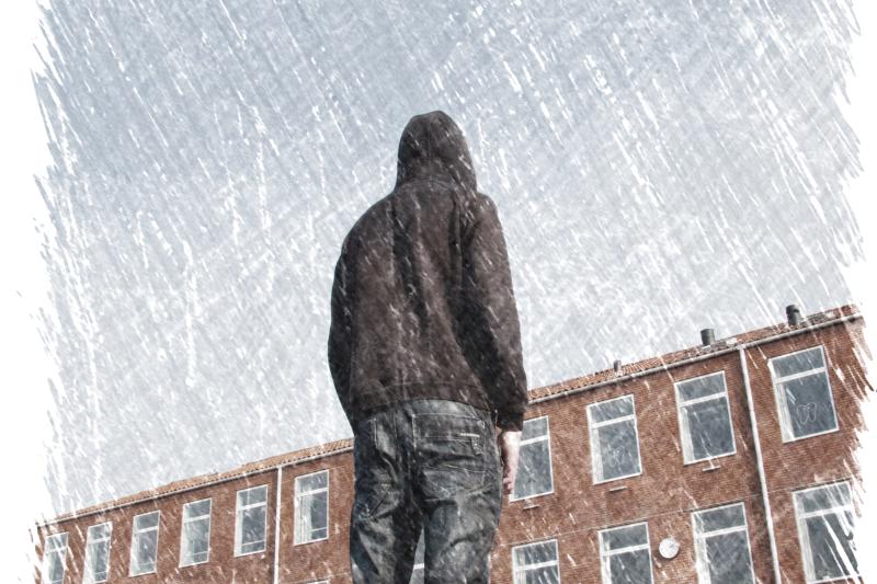 Image of young man outside of a school