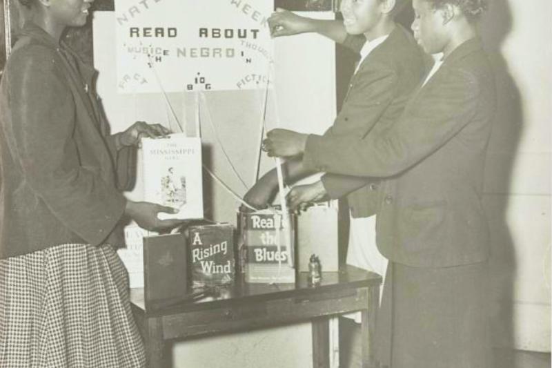 Photo of girls making a display for National Book Week
