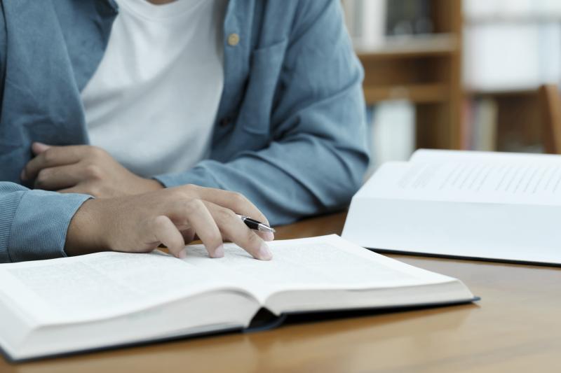 Student reading textbook