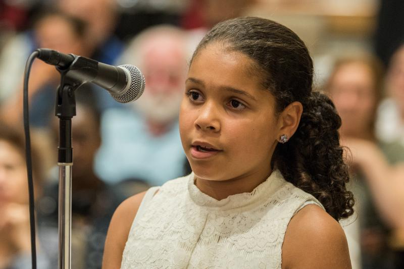 A girl asking a question at an event Q & A