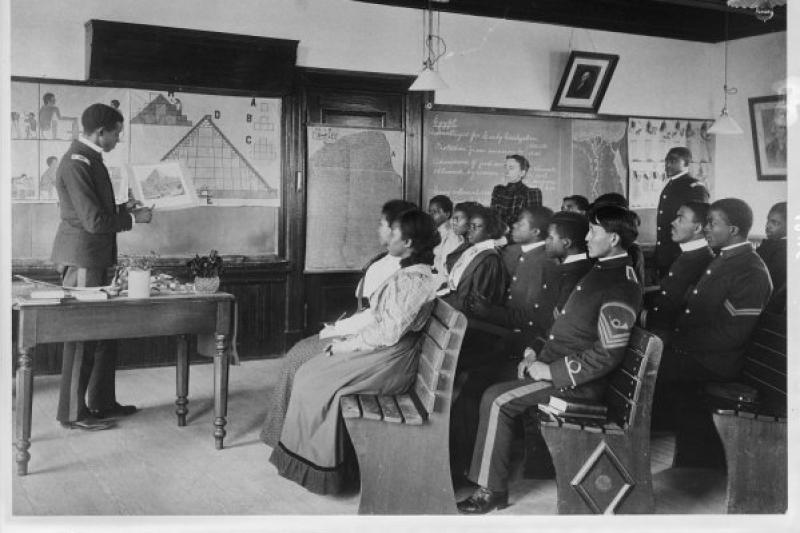 black and white photo of a classroom of students in military uniform.