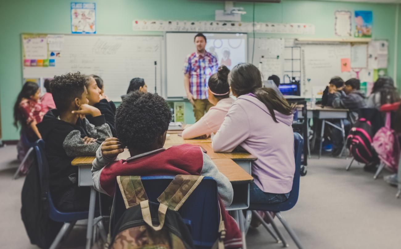 Teacher in front of classroom